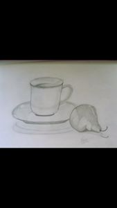 Cup/saucer and pear