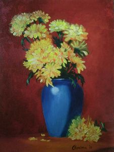 yellow flowers in blue vase