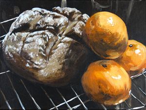fresh bread and tangerine still life - alyssa brown