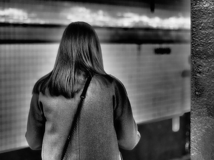 woman waits for train - pictureJemel
