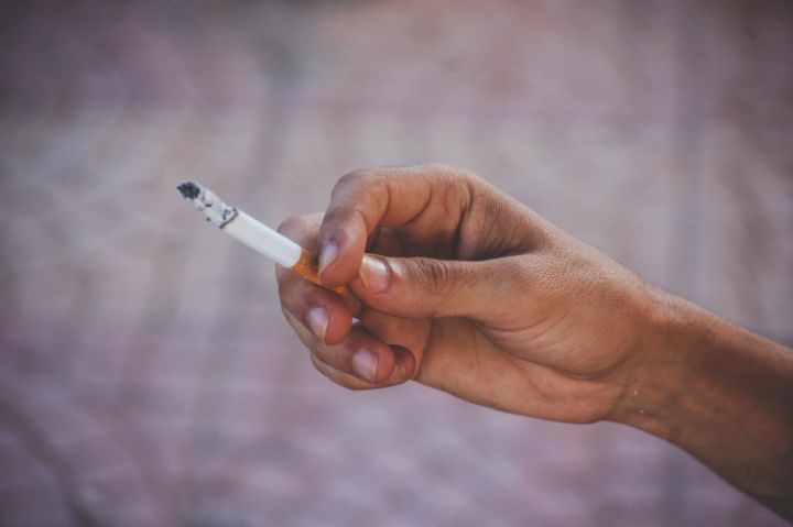 hand holding a cigarette - Waj