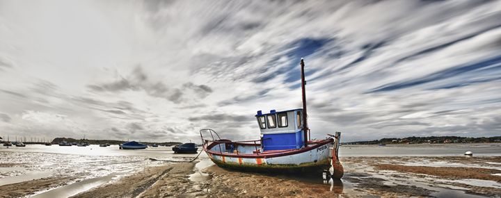 Fishing Boat at low tide - Gem Photography