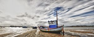 Fishing Boat at low tide - Gem Photography