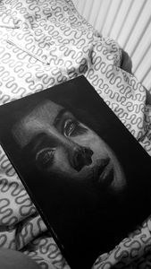 Portrait on black sheet