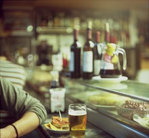 Man tapas and glass of beer