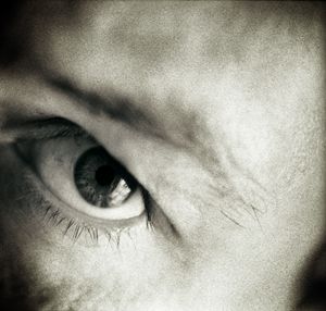 Closeup of eye of man black white