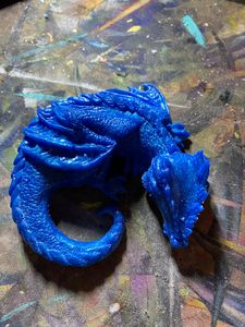 solid blue resting dragon