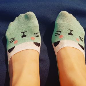Feet with cat socks