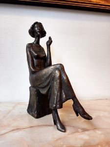 Sculpture of a girl with a cigarette