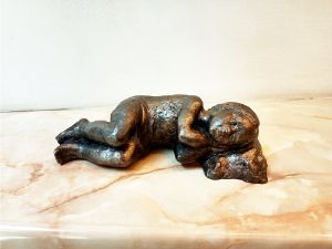 Realistic sculpture of sleep child