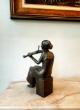 Sculpture of a young violinist