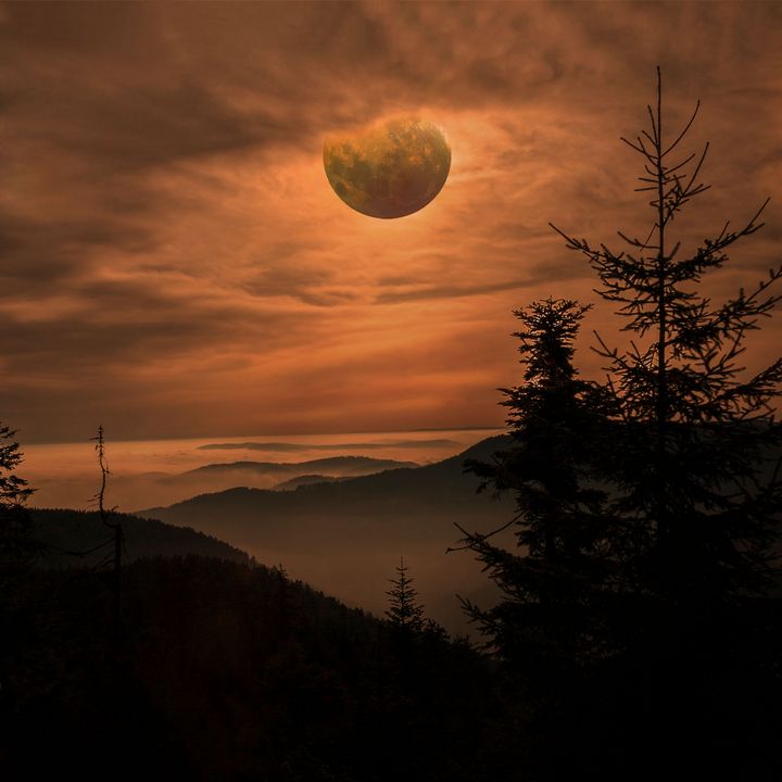 Blood Moon in the Night Cloudy Sky - Creative Photography