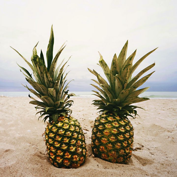 Beautiful fresh pineapple in the bea - Creative Photography