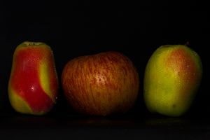 three red and green apples