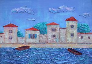 Houses by the sea with boats