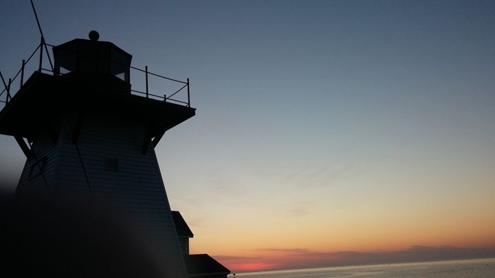 Lighthouse off the Shore - Zach B