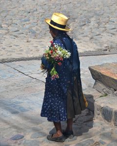 Peruvian Woman Holding Flowers - Catherine Sherman