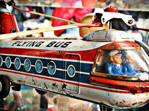 Vintage Flying bus tin toy