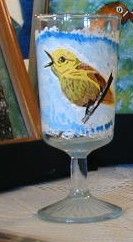 yellow warbler on glass - Marty's Arty