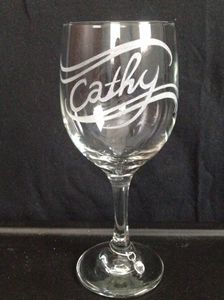 Carved wine glass with wine charm