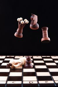 Chess pieces levitate over the chess