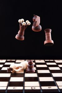 Chess pieces levitate over the chess - Roman Kriuchkov