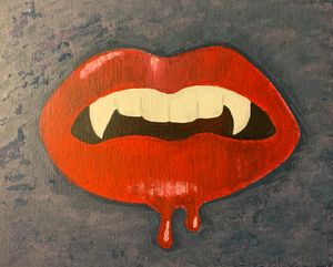 Blood dripping vampire fangs